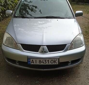 Серый Мицубиси Лансер, объемом двигателя 1.6 л и пробегом 260 тыс. км за 3600 $, фото 1 на Automoto.ua