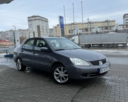 Серый Мицубиси Лансер, объемом двигателя 1.6 л и пробегом 212 тыс. км за 3150 $, фото 1 на Automoto.ua