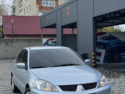 Серый Мицубиси Лансер, объемом двигателя 1.6 л и пробегом 269 тыс. км за 4000 $, фото 1 на Automoto.ua