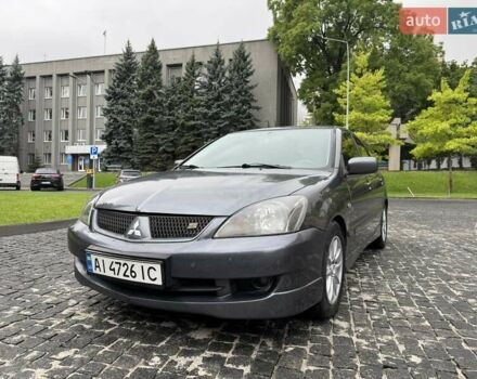 Серый Мицубиси Лансер, объемом двигателя 2 л и пробегом 200 тыс. км за 4300 $, фото 1 на Automoto.ua