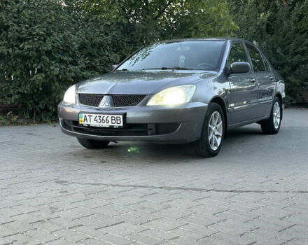 Сірий Міцубісі Lancer, об'ємом двигуна 1.58 л та пробігом 278 тис. км за 3600 $, фото 1 на Automoto.ua