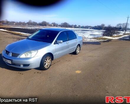 Серый Мицубиси Лансер, объемом двигателя 1.6 л и пробегом 270 тыс. км за 3000 $, фото 1 на Automoto.ua