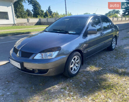 Серый Мицубиси Лансер, объемом двигателя 1.6 л и пробегом 291 тыс. км за 3900 $, фото 1 на Automoto.ua