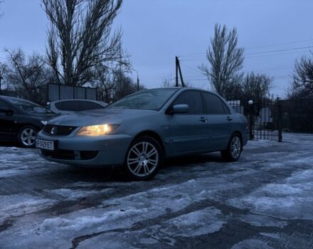 Серый Мицубиси Лансер, объемом двигателя 1.6 л и пробегом 220 тыс. км за 3999 $, фото 1 на Automoto.ua