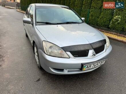 Сірий Міцубісі Lancer, об'ємом двигуна 1.58 л та пробігом 333 тис. км за 2850 $, фото 1 на Automoto.ua