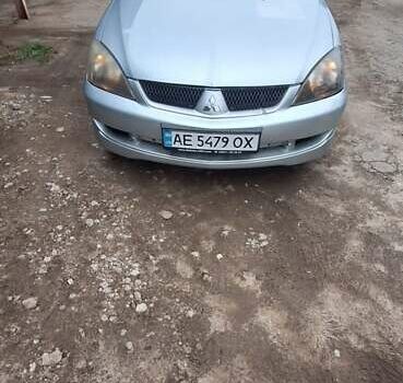 Серый Мицубиси Лансер, объемом двигателя 1.58 л и пробегом 223 тыс. км за 3200 $, фото 1 на Automoto.ua