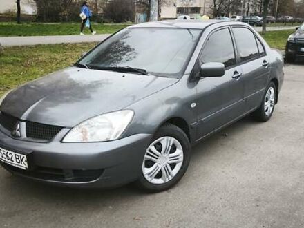 Серый Мицубиси Лансер, объемом двигателя 1.6 л и пробегом 263 тыс. км за 3650 $, фото 1 на Automoto.ua
