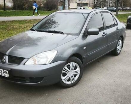 Серый Мицубиси Лансер, объемом двигателя 1.6 л и пробегом 263 тыс. км за 3650 $, фото 1 на Automoto.ua