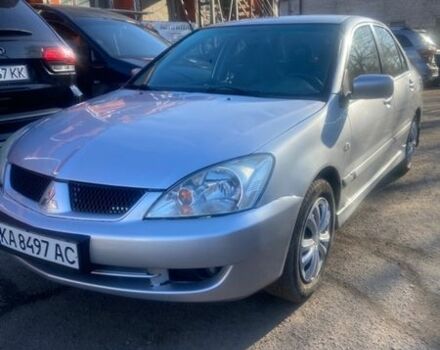 Серый Мицубиси Лансер, объемом двигателя 1.6 л и пробегом 213 тыс. км за 3699 $, фото 1 на Automoto.ua