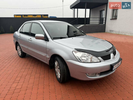 Серый Мицубиси Лансер, объемом двигателя 1.6 л и пробегом 242 тыс. км за 4300 $, фото 1 на Automoto.ua