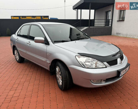 Серый Мицубиси Лансер, объемом двигателя 1.6 л и пробегом 242 тыс. км за 4300 $, фото 1 на Automoto.ua