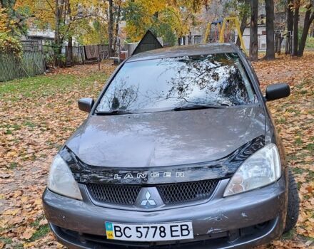 Серый Мицубиси Лансер, объемом двигателя 1.6 л и пробегом 206 тыс. км за 2699 $, фото 1 на Automoto.ua