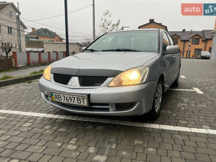 Серый Мицубиси Лансер, объемом двигателя 1.58 л и пробегом 333 тыс. км за 2999 $, фото 1 на Automoto.ua