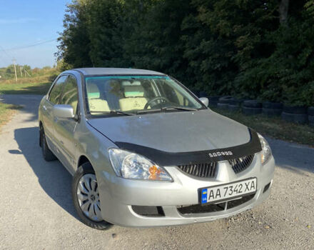Сірий Міцубісі Lancer, об'ємом двигуна 1.58 л та пробігом 275 тис. км за 2900 $, фото 1 на Automoto.ua