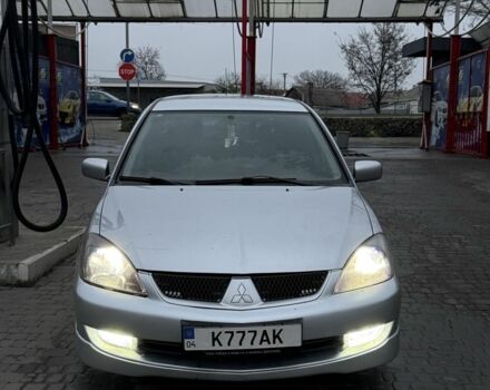 Серый Мицубиси Лансер, объемом двигателя 2 л и пробегом 256 тыс. км за 7000 $, фото 1 на Automoto.ua