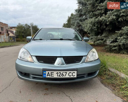 Серый Мицубиси Лансер, объемом двигателя 1.58 л и пробегом 260 тыс. км за 4050 $, фото 1 на Automoto.ua