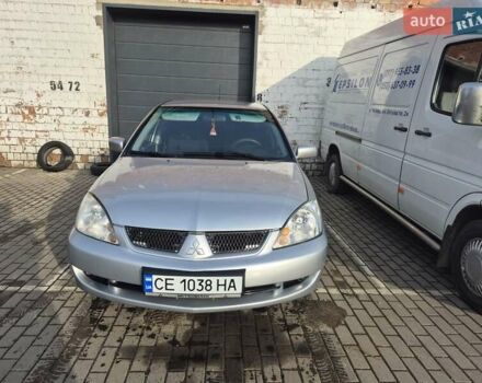 Серый Мицубиси Лансер, объемом двигателя 1.58 л и пробегом 301 тыс. км за 3500 $, фото 1 на Automoto.ua