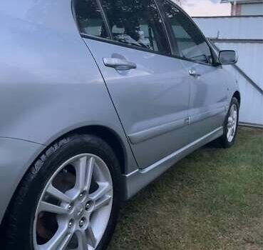 Серый Мицубиси Лансер, объемом двигателя 2 л и пробегом 141 тыс. км за 5200 $, фото 1 на Automoto.ua