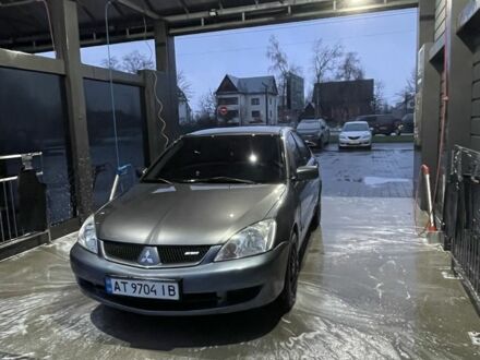 Серый Мицубиси Лансер, объемом двигателя 1.6 л и пробегом 213 тыс. км за 4450 $, фото 1 на Automoto.ua