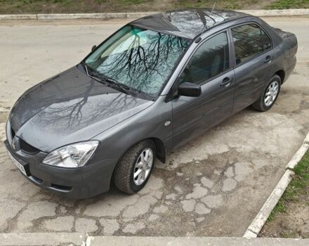 Серый Мицубиси Лансер, объемом двигателя 1.3 л и пробегом 230 тыс. км за 3800 $, фото 1 на Automoto.ua