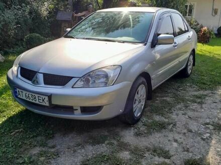 Сірий Міцубісі Lancer, об'ємом двигуна 1.58 л та пробігом 215 тис. км за 5200 $, фото 1 на Automoto.ua