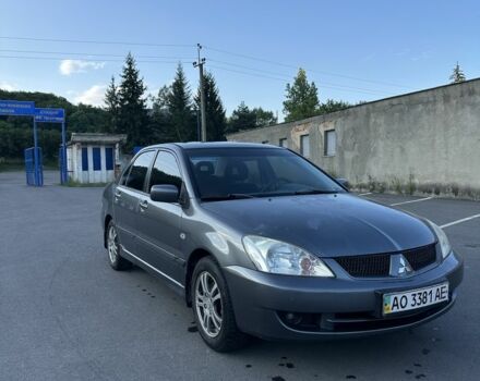 Серый Мицубиси Лансер, объемом двигателя 1.6 л и пробегом 250 тыс. км за 3700 $, фото 1 на Automoto.ua