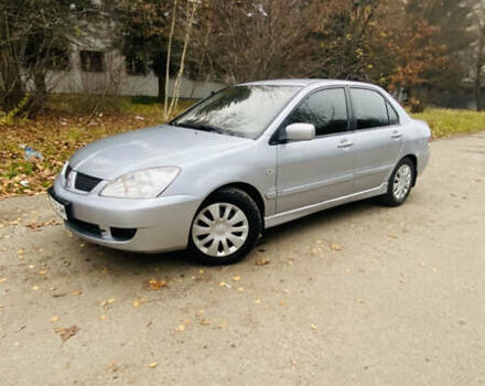 Серый Мицубиси Лансер, объемом двигателя 1.6 л и пробегом 253 тыс. км за 2850 $, фото 1 на Automoto.ua