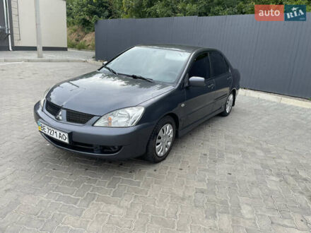 Серый Мицубиси Лансер, объемом двигателя 1.58 л и пробегом 162 тыс. км за 4650 $, фото 1 на Automoto.ua