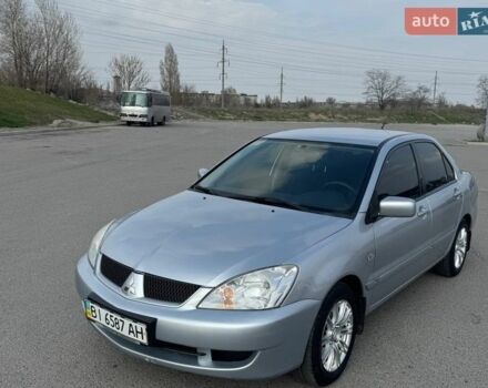 Серый Мицубиси Лансер, объемом двигателя 1.6 л и пробегом 98 тыс. км за 5999 $, фото 1 на Automoto.ua