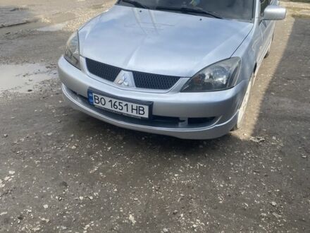 Серый Мицубиси Лансер, объемом двигателя 2 л и пробегом 250 тыс. км за 4058 $, фото 1 на Automoto.ua