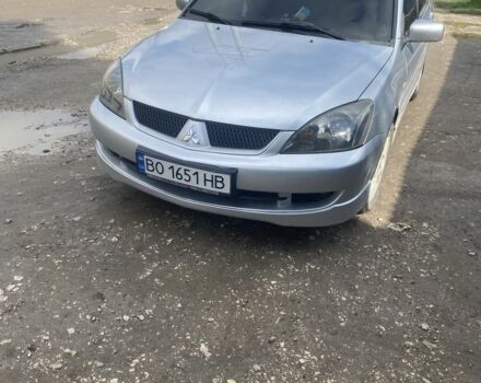 Серый Мицубиси Лансер, объемом двигателя 2 л и пробегом 250 тыс. км за 4058 $, фото 1 на Automoto.ua