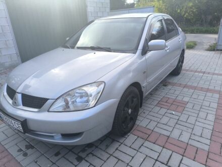Сірий Міцубісі Lancer, об'ємом двигуна 1.6 л та пробігом 240 тис. км за 3400 $, фото 1 на Automoto.ua