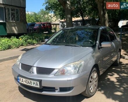 Серый Мицубиси Лансер, объемом двигателя 1.58 л и пробегом 140 тыс. км за 4800 $, фото 1 на Automoto.ua