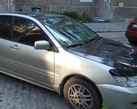 Серый Мицубиси Лансер, объемом двигателя 2 л и пробегом 273 тыс. км за 3500 $, фото 1 на Automoto.ua