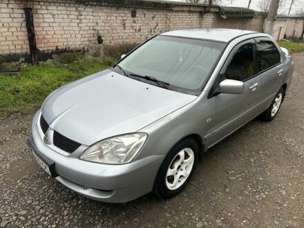 Серый Мицубиси Лансер, объемом двигателя 1.6 л и пробегом 270 тыс. км за 2900 $, фото 1 на Automoto.ua