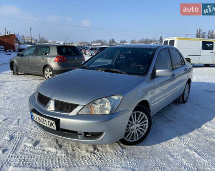 Серый Мицубиси Лансер, объемом двигателя 1.6 л и пробегом 261 тыс. км за 5100 $, фото 1 на Automoto.ua