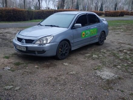 Сірий Міцубісі Lancer, об'ємом двигуна 1.6 л та пробігом 264 тис. км за 3200 $, фото 1 на Automoto.ua
