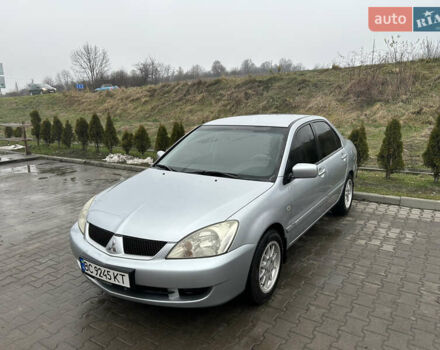 Серый Мицубиси Лансер, объемом двигателя 1.6 л и пробегом 223 тыс. км за 3900 $, фото 1 на Automoto.ua