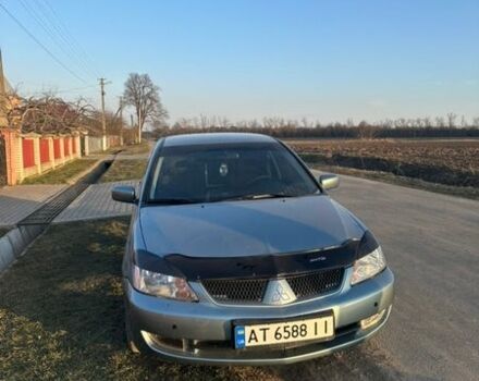 Серый Мицубиси Лансер, объемом двигателя 1.58 л и пробегом 290 тыс. км за 3000 $, фото 1 на Automoto.ua