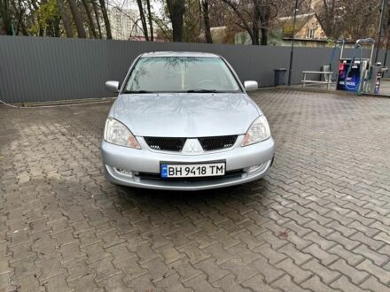 Серый Мицубиси Лансер, объемом двигателя 1.6 л и пробегом 260 тыс. км за 4999 $, фото 1 на Automoto.ua