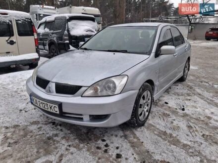 Серый Мицубиси Лансер, объемом двигателя 1.6 л и пробегом 245 тыс. км за 3999 $, фото 1 на Automoto.ua