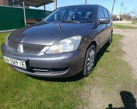 Серый Мицубиси Лансер, объемом двигателя 1.6 л и пробегом 298 тыс. км за 2900 $, фото 1 на Automoto.ua