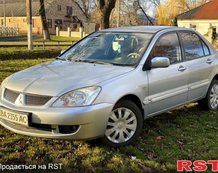 Серый Мицубиси Лансер, объемом двигателя 1.6 л и пробегом 250 тыс. км за 4000 $, фото 1 на Automoto.ua