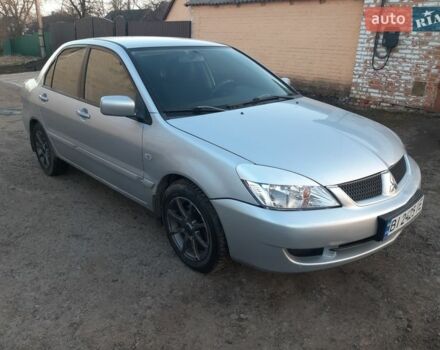 Серый Мицубиси Лансер, объемом двигателя 1.58 л и пробегом 187 тыс. км за 2699 $, фото 1 на Automoto.ua