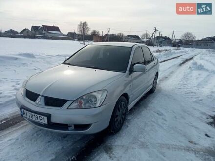 Сірий Міцубісі Lancer, об'ємом двигуна 1.58 л та пробігом 297 тис. км за 3555 $, фото 1 на Automoto.ua