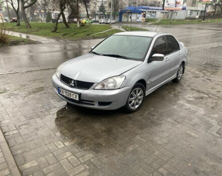 Серый Мицубиси Лансер, объемом двигателя 1.6 л и пробегом 250 тыс. км за 2350 $, фото 1 на Automoto.ua
