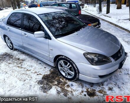 Серый Мицубиси Лансер, объемом двигателя 2 л и пробегом 28400 тыс. км за 3600 $, фото 1 на Automoto.ua