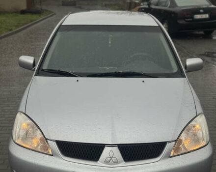 Серый Мицубиси Лансер, объемом двигателя 1.6 л и пробегом 280 тыс. км за 2800 $, фото 1 на Automoto.ua