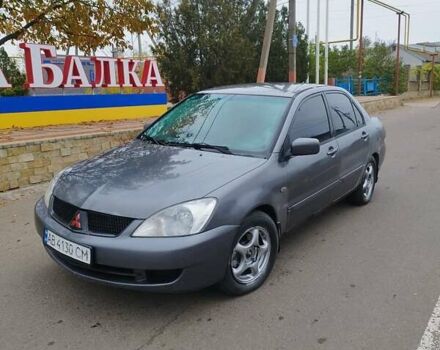 Серый Мицубиси Лансер, объемом двигателя 1.6 л и пробегом 250 тыс. км за 3800 $, фото 1 на Automoto.ua