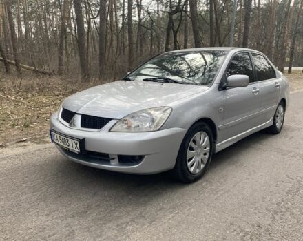 Серый Мицубиси Лансер, объемом двигателя 1.6 л и пробегом 247 тыс. км за 5400 $, фото 1 на Automoto.ua